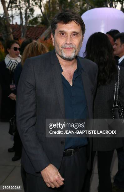 Director Eric Barbier poses during opening night of the 2018 COLCOA French Film Festival, April 23, 2018 at the Directors Guild of America Theater in...