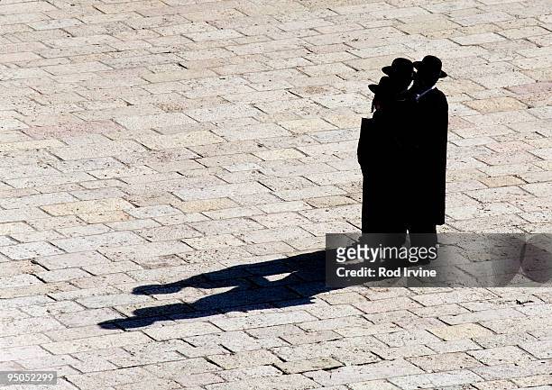 three orthodox jews in jerusalem - orthodox jew stock pictures, royalty-free photos & images