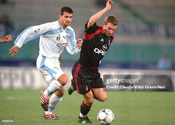 Andrei Shevchenko of AC Milan runs past Dejan Stankovic of Lazio during the Italian Serie A match played at the Stadio Olimpico, in Rome, Italy. The...