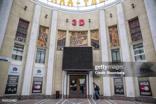 Man walks towards the Ala-Too Cinema in Bishkek, Kyrgyzstan, on Wednesday, April 18, 2018. Bishkek is the capital and largest city of Kyrgyzstan, a...