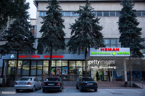 Car sit parked in front of a supermarket in Bishkek, Kyrgyzstan, on Thursday, April 19, 2018. Bishkek is the capital and largest city of Kyrgyzstan,...