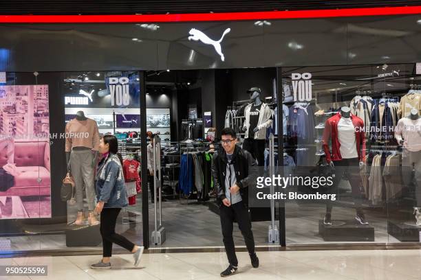Shoppers exit a Puma SE store inside the Asia Mall shopping and entertainment center in Bishkek, Kyrgyzstan, on Friday, April 20, 2018. Bishkek is...
