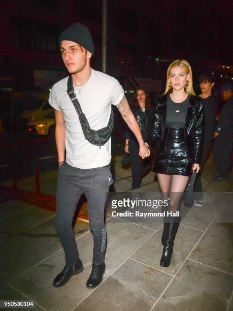 Model Anwar Hadid and Nicola Peltz are seen arriving at Gigi Hadid's party in Brooklyn on April 23, 2018 in New York City.