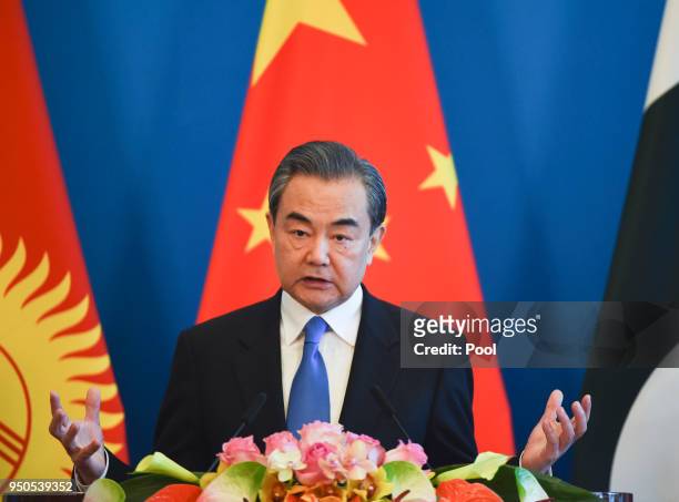 Chinese State Councilor and Foreign Minister Wang Yi gives a press conference after a meeting of foreign ministers and officials of the Shanghai...