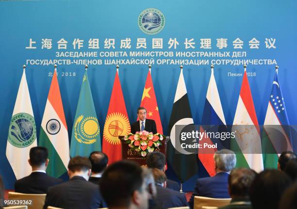 Chinese State Councilor and Foreign Minister Wang Yi gives a press conference after a meeting of foreign ministers and officials of the Shanghai...