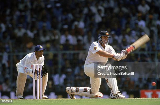 Matthew Hayden of Australia plays a sweep shot during his first innings score of 203 during the Third Test match against India played at the...