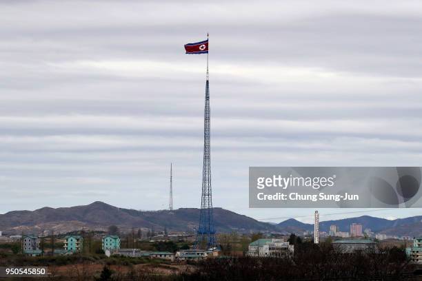 North Korean national flag flies in North Korea's propaganda village of Gijungdong, seen from South Korea's Taesungdong freedom village on April 24,...
