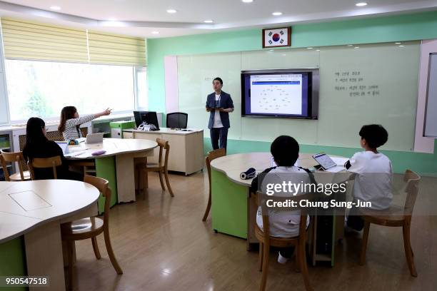 South Korean children take a class at the Taesungdong elementary school on April 24, 2018 in Paju, South Korea. Taesungdong is the only civilian...