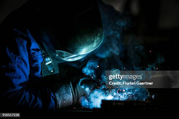 Worker welds metal in the workshop of a blacksmith on April 03, 2018 in Klitten, Germany.