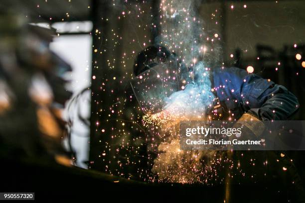 Worker is welding the workshop of a blacksmith on April 03, 2018 in Klitten, Germany.