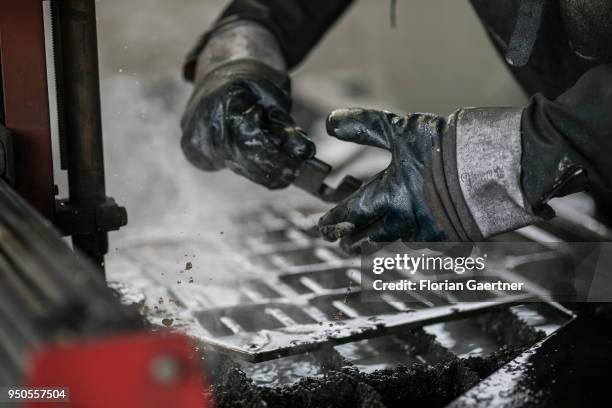 Worker works on a laser cutter in the workshop of a blacksmith on April 03, 2018 in Klitten, Germany.