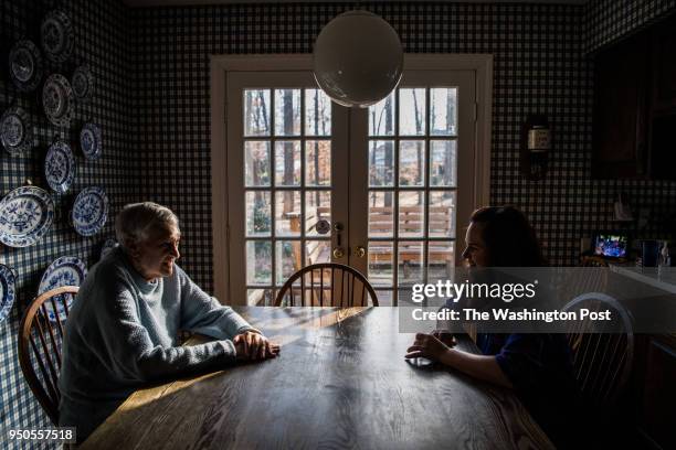 Wayne Cooper and his daughter Patricia Cooper chat at the kitchen table at home on Friday, December 29 in McClean, VA. Cooper is recovering from a...