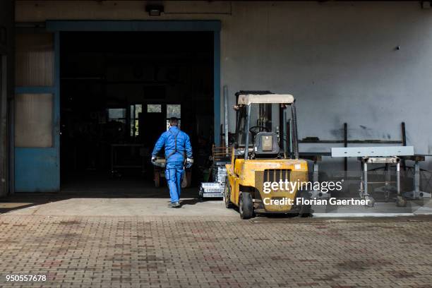 Worker enters the workshop of a blacksmith shop on April 03, 2018 in Klitten, Germany.