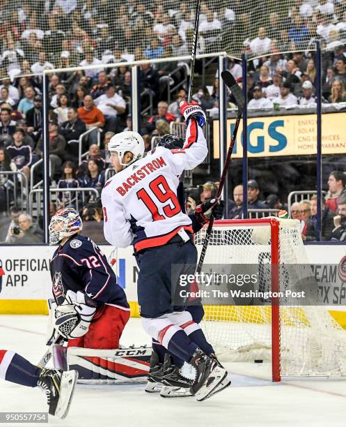 Washington Capitals center Nicklas Backstrom celebrates a goal by Dmitry Orlov against Columbus Blue Jackets goaltender Sergei Bobrovsky in the first...