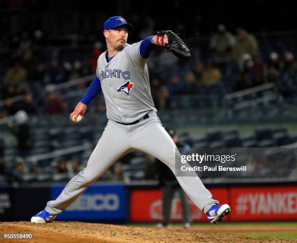 Relief pitcher John Axford of the Toronto Blue Jays pitches in an MLB baseball game against the New York Yankees on April 19, 2018 at Yankee Stadium...