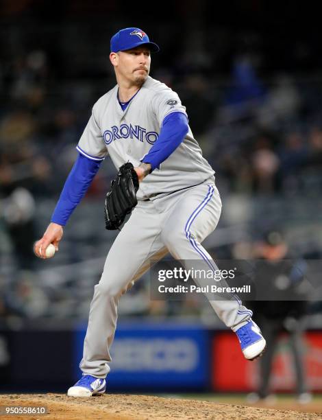 Relief pitcher John Axford of the Toronto Blue Jays pitches in an MLB baseball game against the New York Yankees on April 19, 2018 at Yankee Stadium...