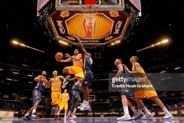 Gabe Pruitt of the Los Angeles D-Fenders gets to the hoop against Amara Sy and the Bakersfield Jam at Staples Center on December 22, 2009 in Los...