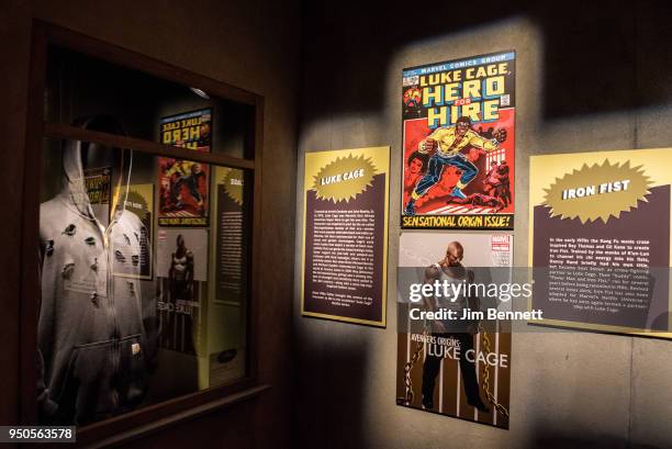 Replica comic covers and the bullet-holed sweatshirt from Luke Cage are on display on opening night of the Marvel: Universe of Super Heroes exhibit...