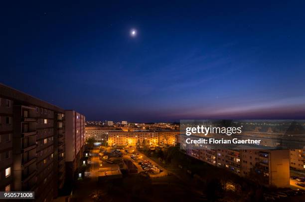 Blocks of flats are pictured at dusk on April 20, 2018 in Stendal, Germany.