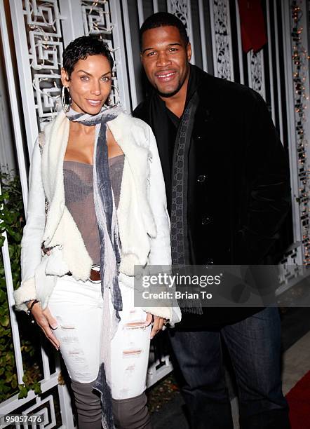 Nicole Murphy and Michael Strahan attend Norwood Young's Annual White Christmas Party on December 22, 2009 in Los Angeles, California.