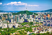 Seoul downtown cityscape with fortress and Namsan Seoul Tower on sunset Seoul, South Korea.