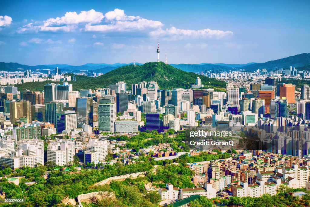 Seoul downtown cityscape with fortress and Namsan Seoul Tower on sunset Seoul, South Korea.