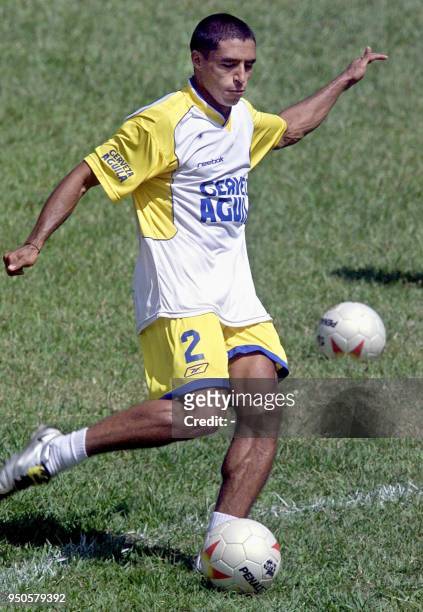 Colombian defense player, Ivan Cordoba, plays with a soccer ball during a training session, 24 July 2001, at Bolo Club in Armenia, Colombia. Colombia...