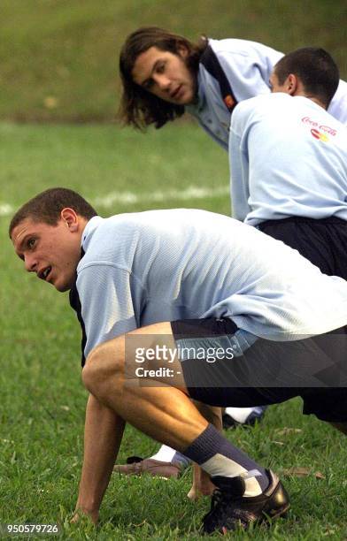 Uruguayan Diego Perez and Gonzalo Sorondo , warm up during a training session 20 July 2001 in Bolo Club, Armenia, Colombia. Uruguay will play Costa...
