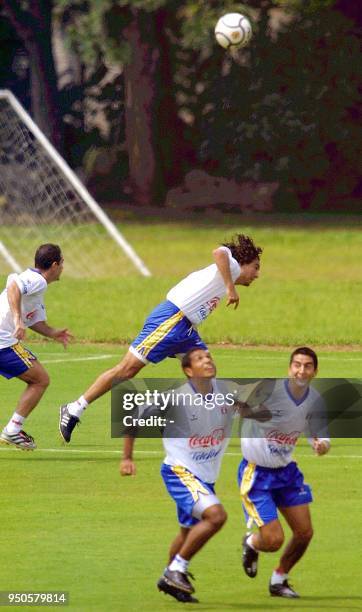 Peruvian soccer player, Jose Del Solar, jumps to head the ball, 14 July 2001, during a practice in Cali, Colombia. Peru will play Brazil 15 July. El...