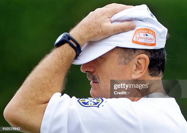 Head coach of the Brazilian soccer team, Luis Felipe Scolari, clasps his head in hand, 13 July, during a practice in Cali, Colombia. Brazil lost to...