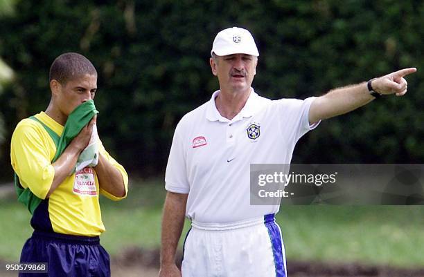 Head coach of the Brazilian soccer team, Luis Felipe Scolari , gives instructions to Alex, 14 July 2001, during a practice in Cali, Colombia. Brazil...