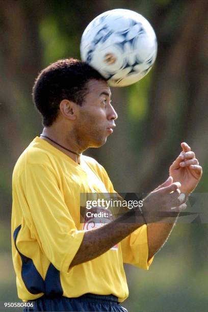 Junior, player of the Brazilian soccer team and who also plays for the Italian team, Parma, heads the ball, 10 July 2001, during Brazil's first...