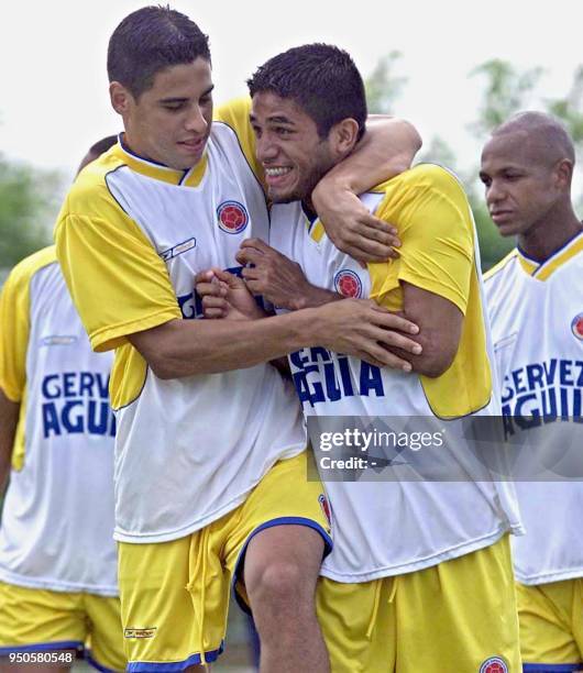 Colombian players Mao Molina and Fabian Vargas, joke during training for the Copa America 10 July, 2001 in Barranquilla, Colombia. Colombia is...