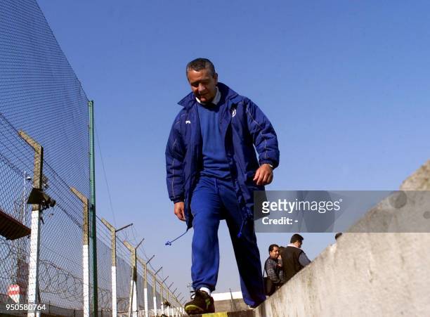The coach of Mexico's Cruz Azul, Jose Luis Trejo, leaves the pitch after a team practice 26 June in Buenos aires. Cruz Azul prepares to meet...