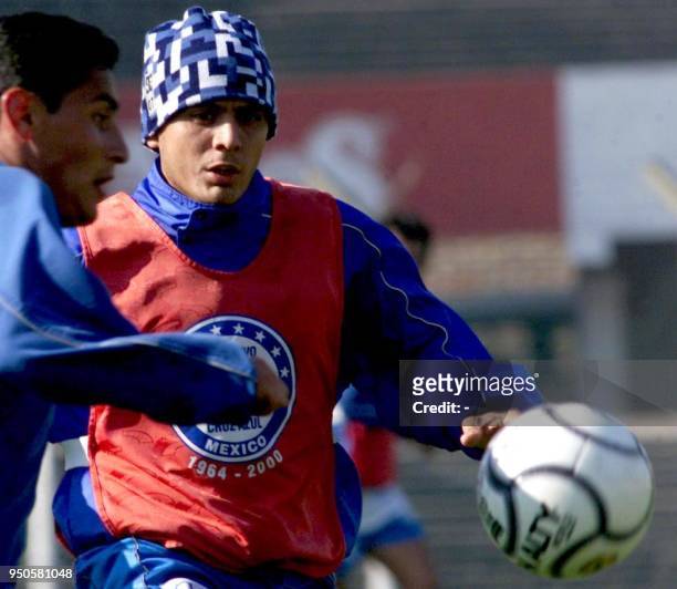 Angel Morales, player of Mexico's Cruz Azul, fights for the ball with a reserve player during a training session at the Independiente Club in Buenos...