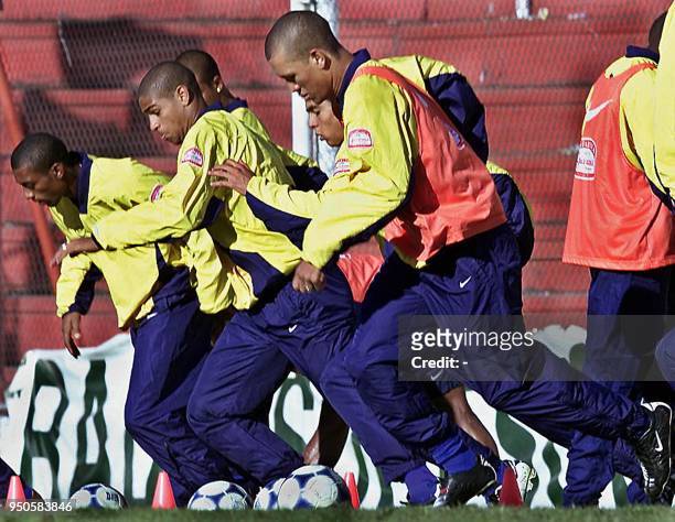 Brazilian soccer players Robert, Adriano, Kaka and Julio, run through a series of exercises 22 June 2001 in the Argentine city of Cordoba. Brazil is...