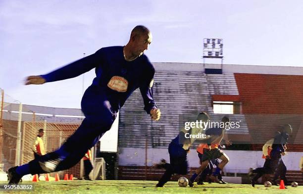 Brazilian soccer player Luizao prepares to kick the ball together with his teammates , 22 June 2001, during a practice in Cordoba, Argentina. El...