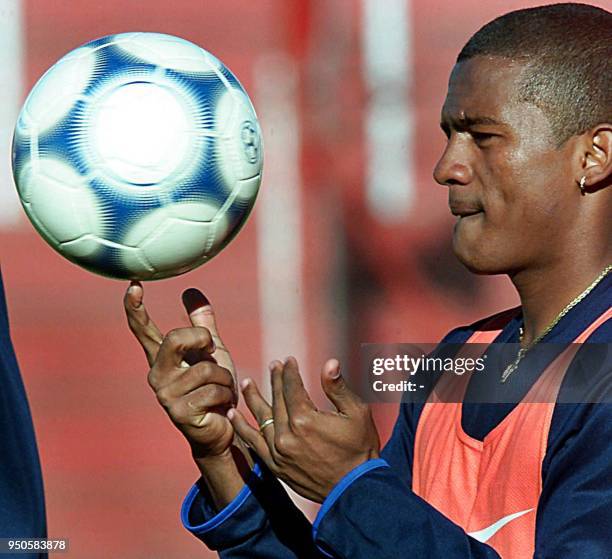 Brazilian player Pinga plays with the ball during a round of practice 22 June 2001 in Cordoba, Argentina. Brazil will face Canada 23 June 2001 in a...