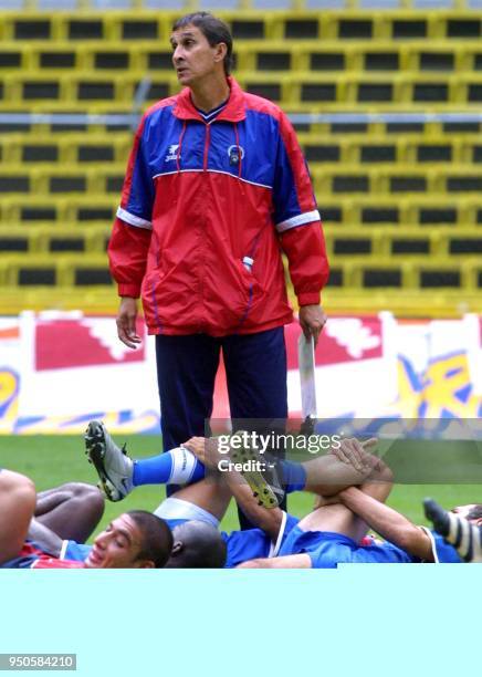 Head coach of the Costa Rican soccer team, Alexander Guimaraes , watches the players as they warm-up for practice at the Azteca Stadium, in Mexico...