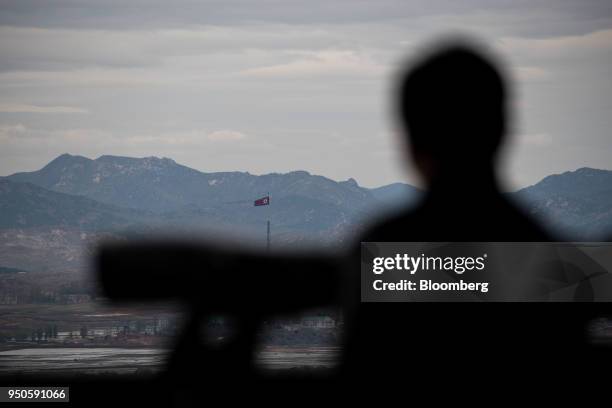 North Korean flag flying over North Korea's Gijungdong village is seen from the Dorasan Observatory in the Demilitarized Zone in Paju, South Korea,...