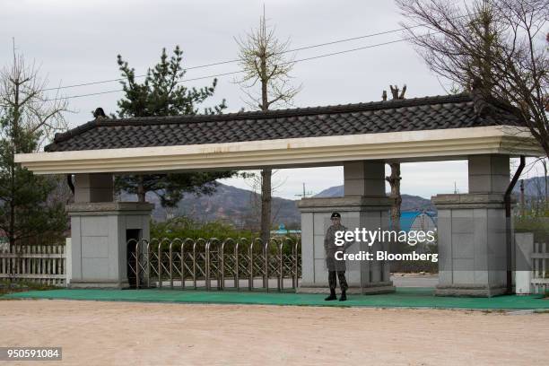 South Korean soldier stands guard at the Daeseong-dong elementary school in the Demilitarized Zone in Paju, South Korea, on Tuesday, April 24, 2018....