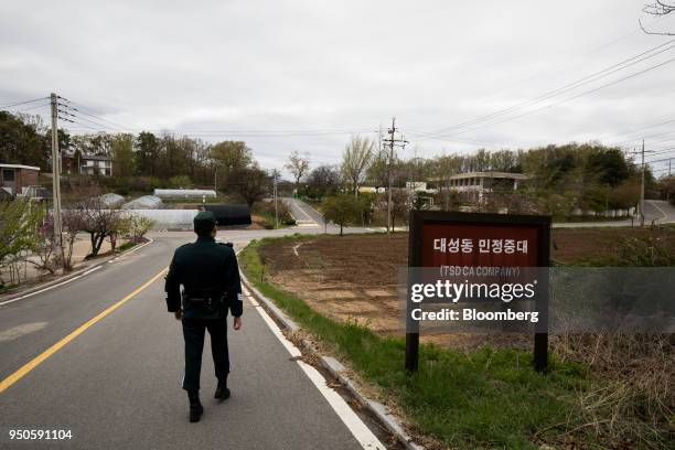 South Korean soldier walks through the Daeseong-dong village in the Demilitarized Zone in Paju, South Korea, on Tuesday, April 24, 2018. The leaders...