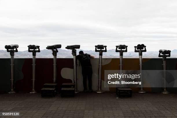 Visitor looks towards the Kaesong Industrial Complex in North Korea from the Dorasan Observatory in the Demilitarized Zone in Paju, South Korea, on...