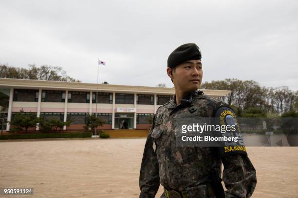 South Korean soldier stands guard outside the Daeseong-dong elementary school in the Demilitarized Zone in Paju, South Korea, on Tuesday, April 24,...