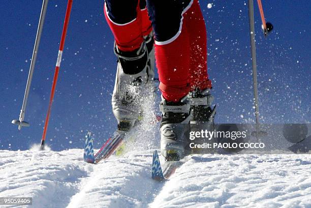 Skiers compete in the World Cup women's 15km pursuit cross country race in Tesero 11 December 2004. Norway's Marit Bjoergen won the race while...