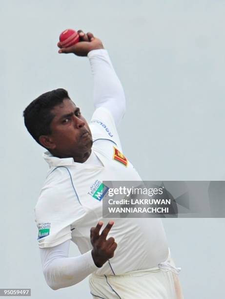 Sri Lankan cricketer Rangana Herath delivers the ball during the third day of the second Test match between Pakistan and Sri Lanka at The P....