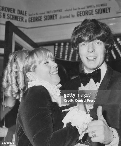 English actress Julia Foster with her husband, singer Lionel Morton, at the world premiere of the musical 'Half a Sixpence', directed by George...