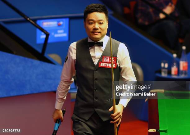 Ding Junhui of China walks off stage after winning his first round match against Xiao Guodong of China of during day four of the World Snooker...