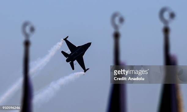 SoloTurk, the F-16 solo aerobatics display team of the Turkish Air Force, performs during a ceremony at Canakkale Martyrs' Memorial in Gallipoli...