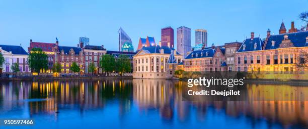 panoramic view of the hague downtown city skyline and parliament buildings at twilight, netherlands - the hague stock pictures, royalty-free photos & images